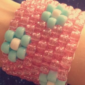 Pink kandi cuff with flowers